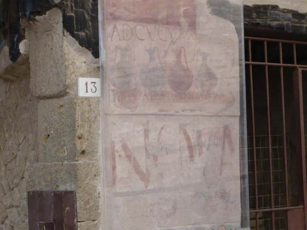 VI.13 Herculaneum on left, VI.14 on right. May 2009.
Painted sign on pilaster between house entrance and shop. Looking south.
Photo courtesy of Buzz Ferebee.
According to Pesando and Guidobaldi, the very ancient painted graffiti NOLA, in red letters on the lower part, came to light during the restoration of the panel above. This was the announcement of a gladiatorial spectacle, inscribed by the scr (iptor) Aprilis of Capua, evidently a travelling scribe.
See Pesando, F. and Guidobaldi, M.P. (2006). Pompei, Oplontis, Ercolano, Stabiae. Editori Laterza, (p.366).